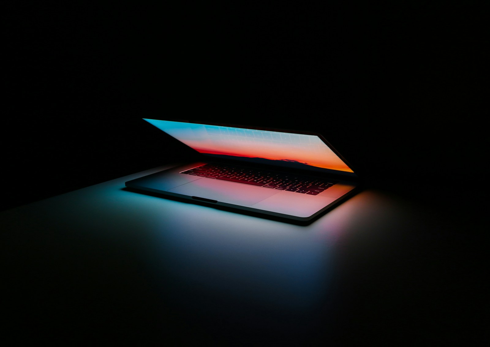 Premium laptop glowing in the dark - Black Flag Media web design studio